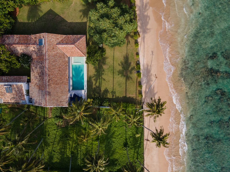 Aerial view of the villa pool and the shoreline