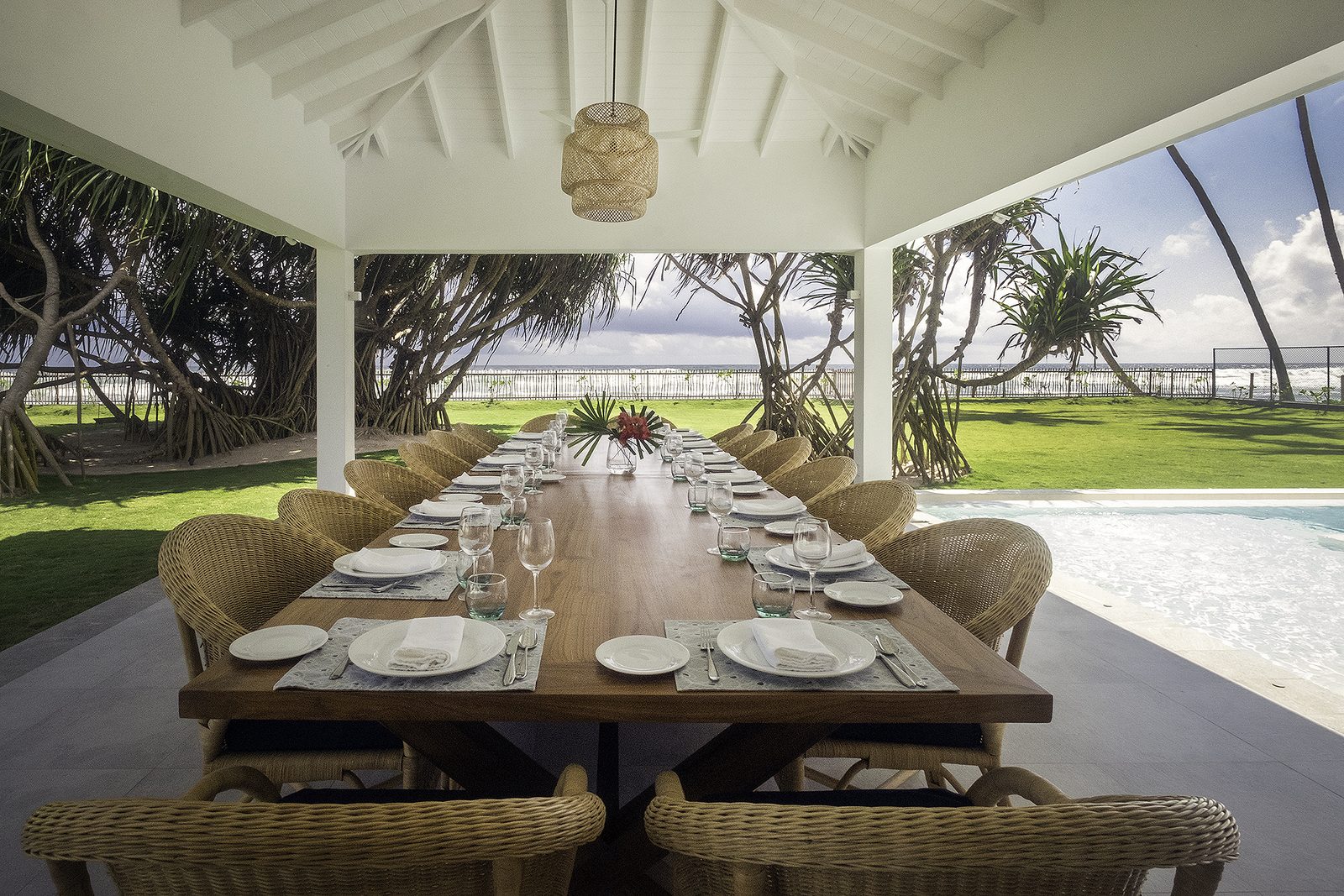 The long dining table in the beachfront pavilion