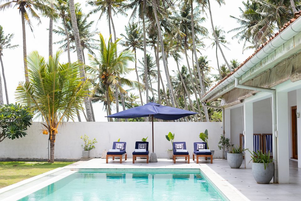 Sun loungers and umbrellas beside the pool