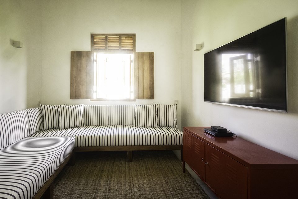 The banquette seating in the villa TV room